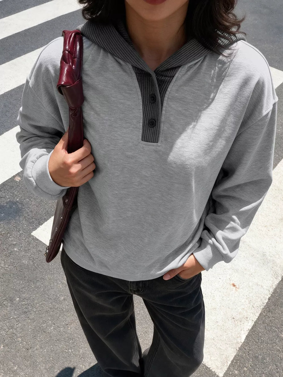 100% polyester Care instructions: Machine wash cold pullover hoodie in Gray with relaxed silhouette