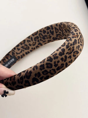 Leopard print padded headband in brown and tan with a comfortable, wide design.