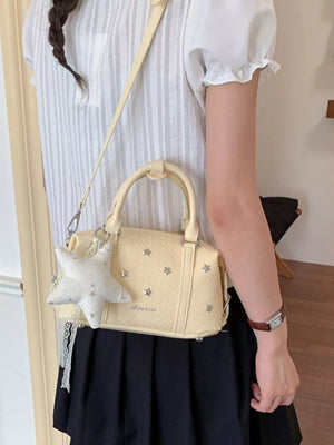 crossbody bag in White with star and star embellishments