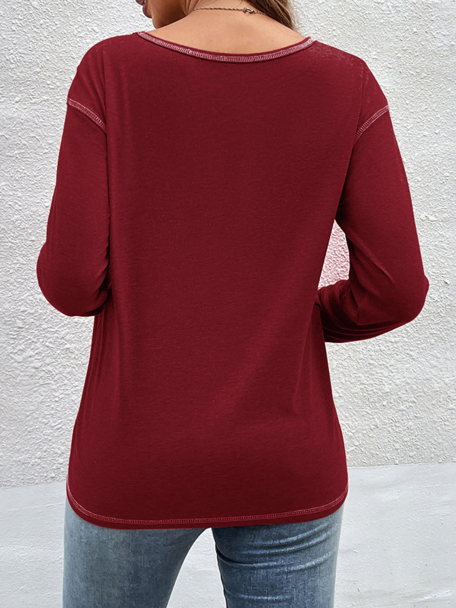 Gray t-shirt with decorative buttons and long sleeve
