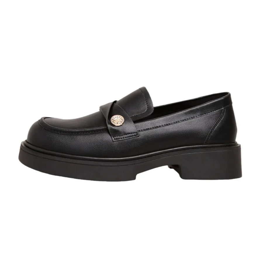 Black penny loafers with gold detail and platform sole