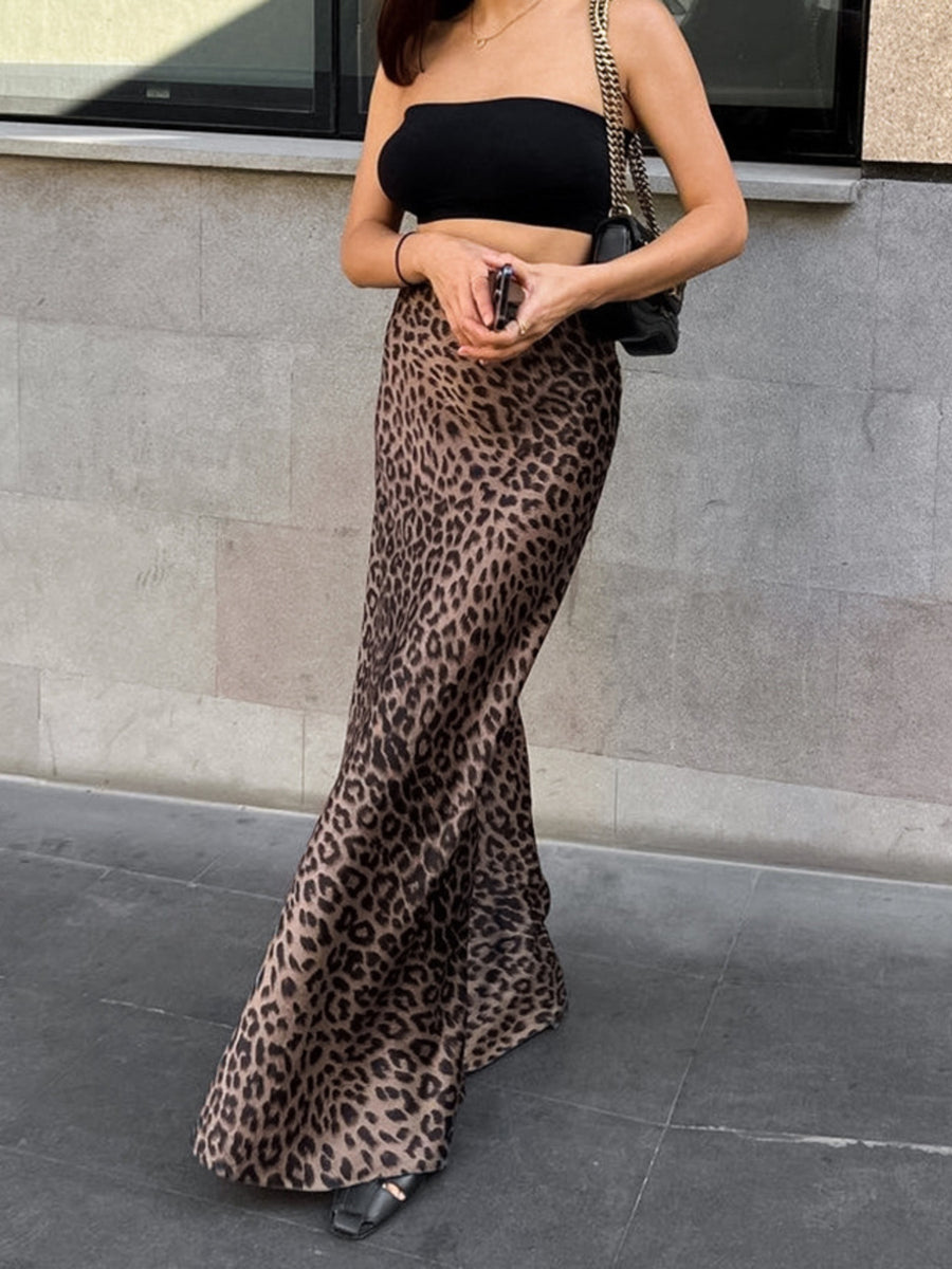 Flowy leopard print maxi skirt with a satin finish, styled with a black tube top.