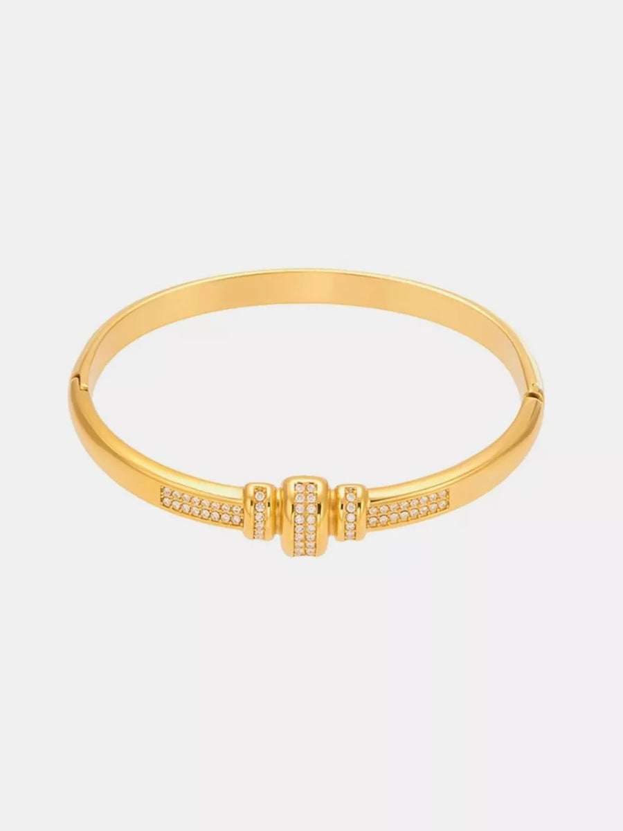 bracelet in gold featuring zircon embellishment and bangle fit