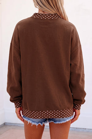 white sweatshirt featuring oversized and polka dot