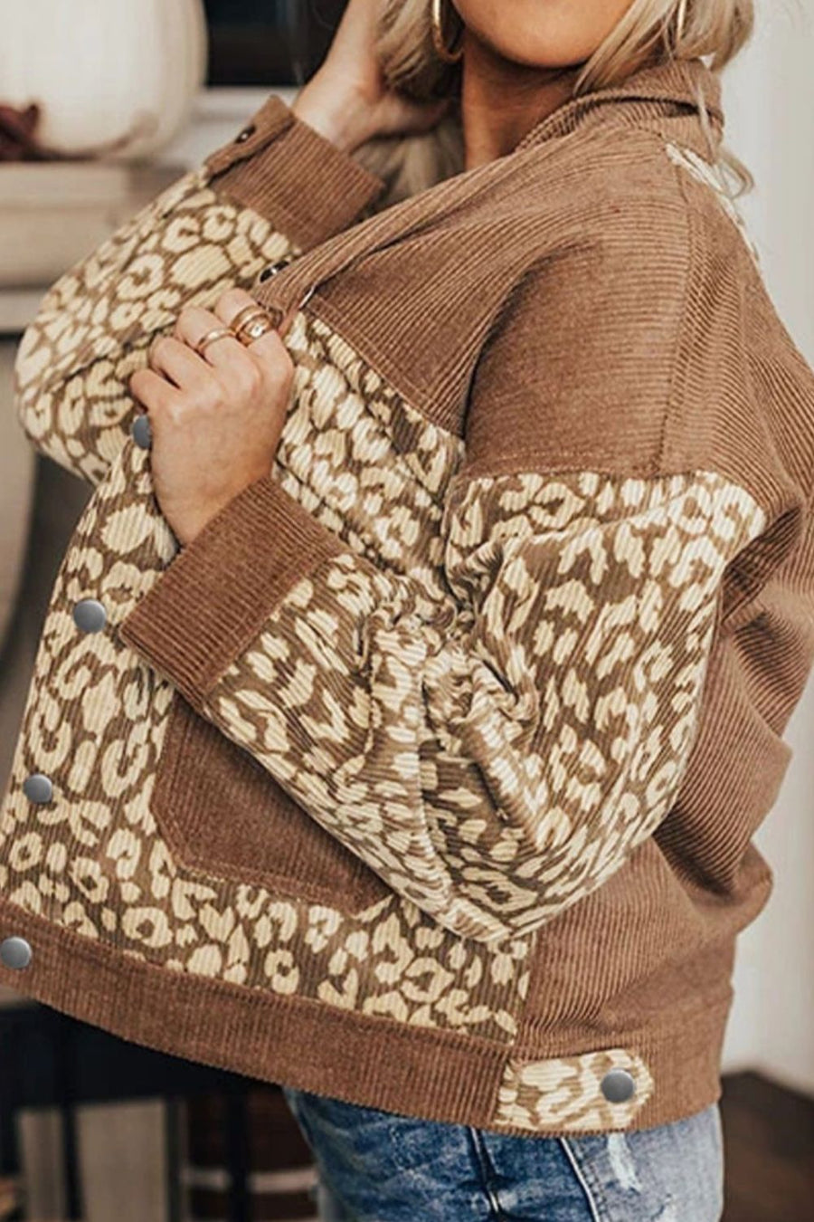 Camel corduroy jacket with leopard print panels and button details.