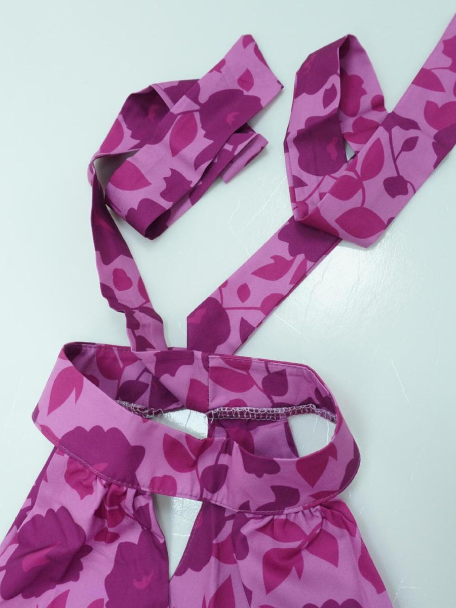 maxi dress in deep purple with floral and cutout