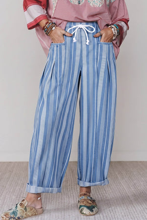 jeans in light blue featuring drawstring waist and wide-leg fit