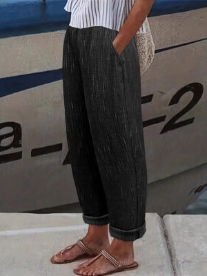 pants in charcoal featuring pocketed and loose fit