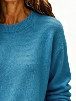 100% polyester Care instructions: Machine wash cold pullover sweater in Cerulean with loose silhouette