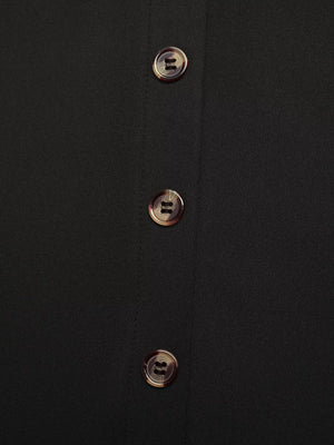 Black midi skirt with tortoise shell button front detail