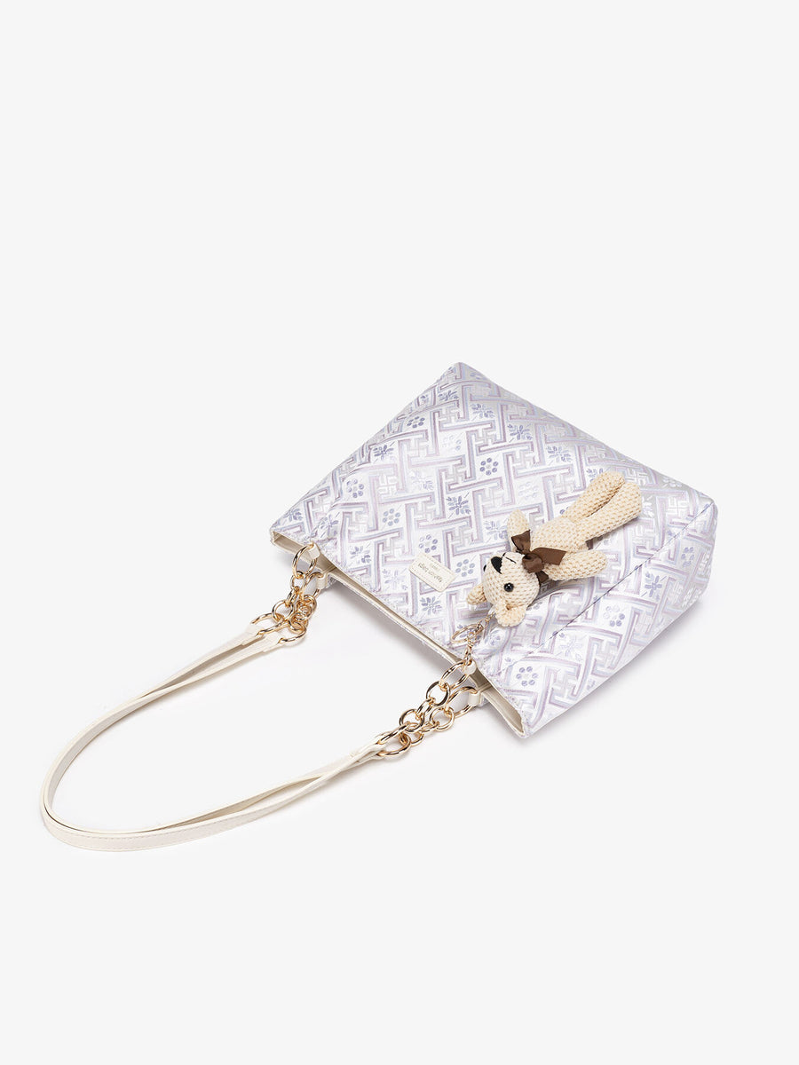handbag featuring geometric in cream with Polyester Imported Size & texture