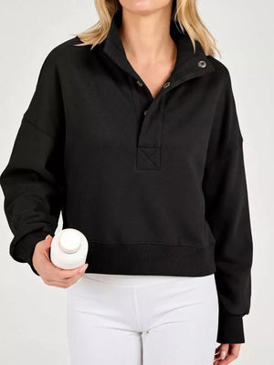 100% polyester Care instructions: Machine wash cold sweatshirt in Black with relaxed silhouette