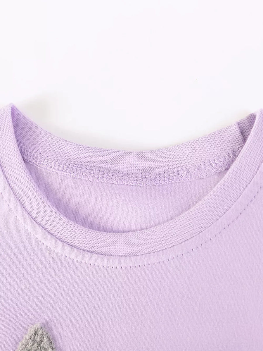 Lavender cotton baby dress with bunny appliqué detail at neckline.