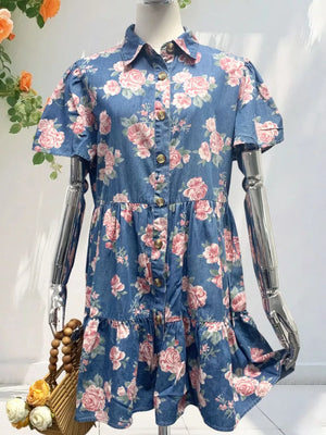 Denim floral mini dress with ruffled tiers and button front.