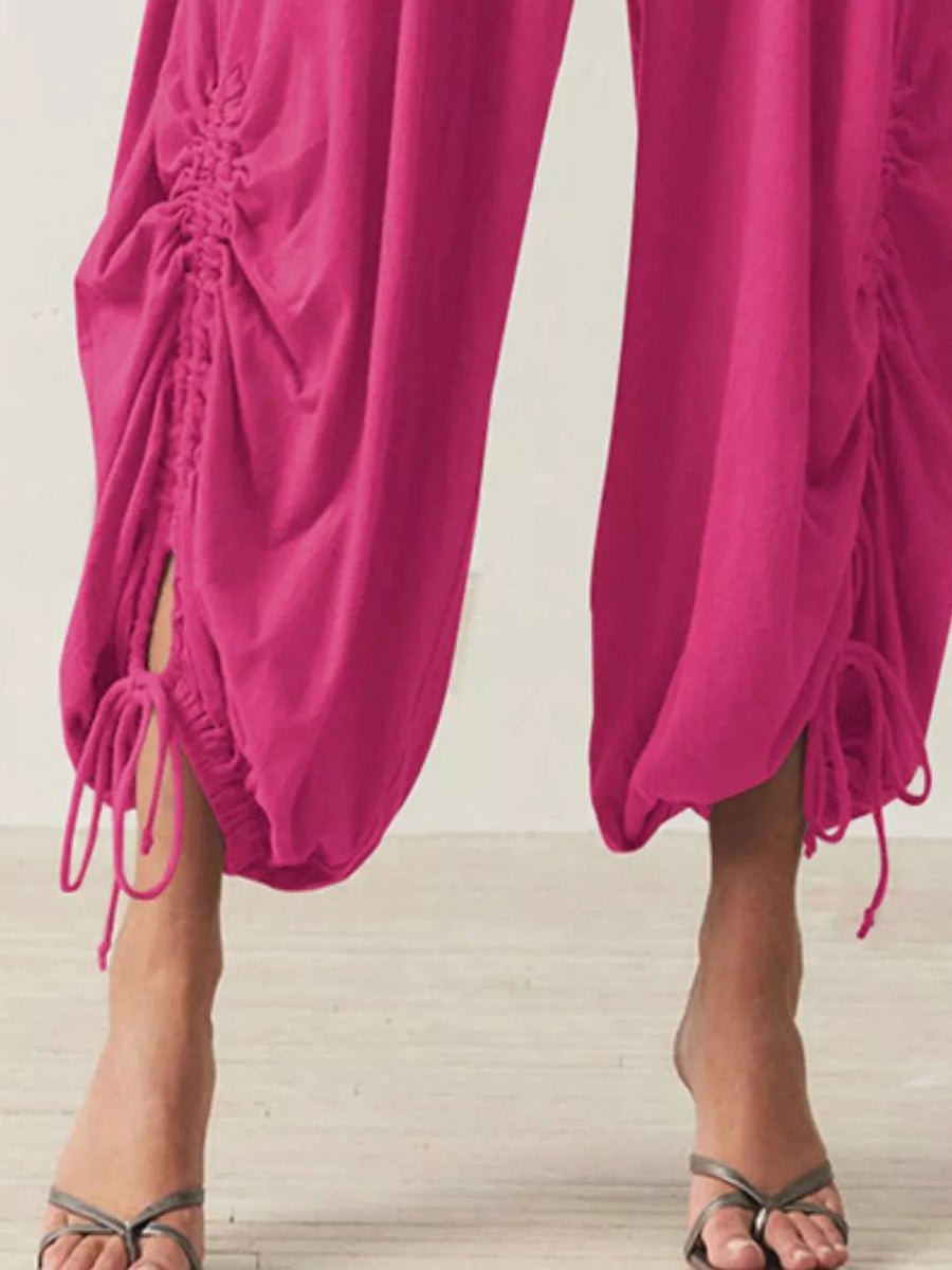 100% polyester Care instructions: Machine wash cold harem pants in Black with loose silhouette