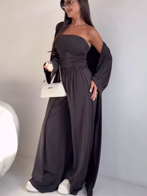 Chic dark gray three-piece maternity set with strapless crop top, wide-leg pants, and long cardigan.