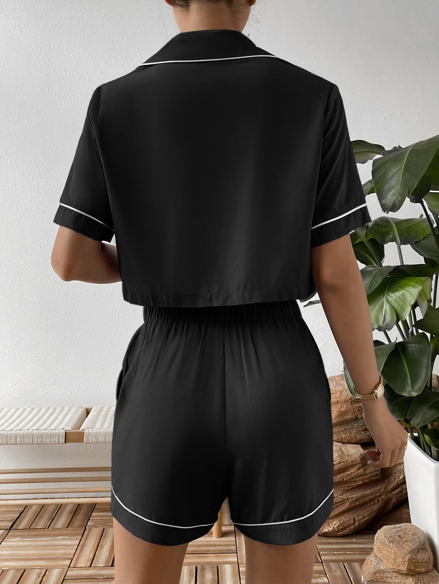 Black cropped pajama set with contrast trim, short sleeves and shorts