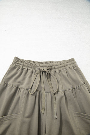 wide-leg pants in Army Green with drawstring waist and full-length