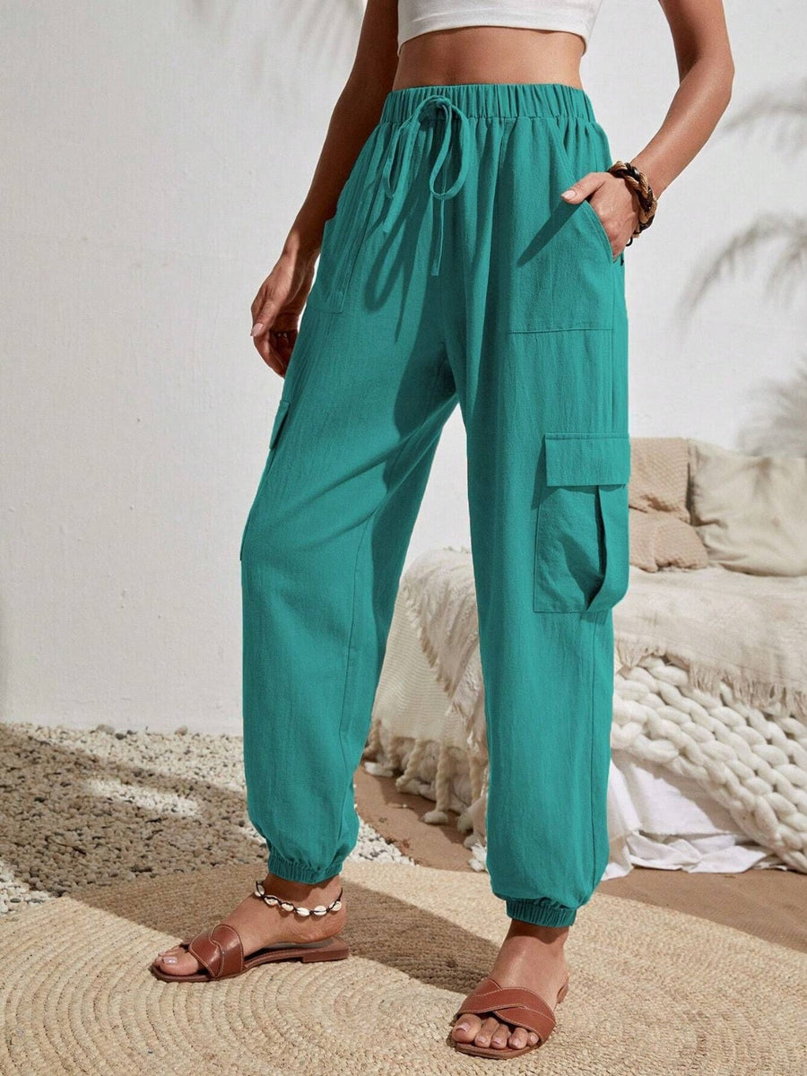 Turquoise textured cargo lounge trousers with drawstring waist and elastic cuffs.