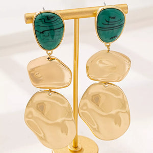 emerald green earrings featuring drop design and marbled
