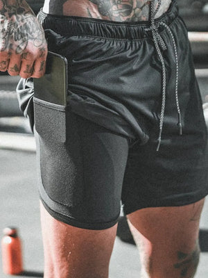 Black dual-layer performance shorts with phone pocket and drawstring waist