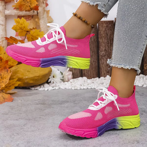 Breathable mesh lace-up sneakers in pink with a purple and yellow gradient sole.