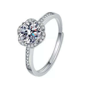 silver ring with moissanite stone and null