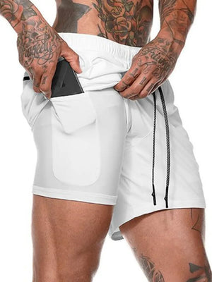 White dual-layer performance shorts with built-in compression liner and phone pocket.