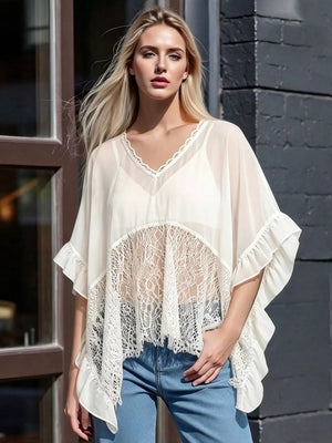 White sheer flowing cover-up tunic with lace trim and ruffled sleeves.
