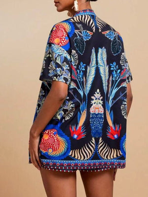 Navy tropical print cardigan with short sleeves and drawstring shorts.