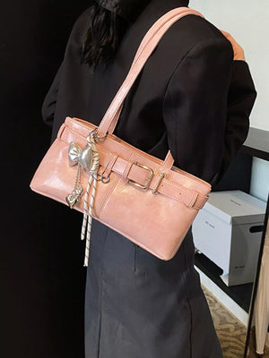 Blush pink shoulder bag with buckle detail and heart charm