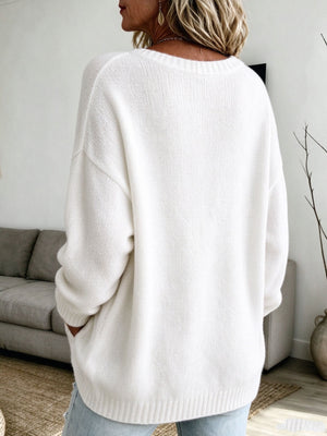 100% polyester Care instructions: Machine wash cold pullover sweater in ivory with relaxed silhouette