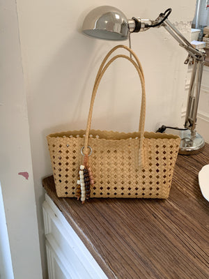 Green shoulder bag with open-top and woven