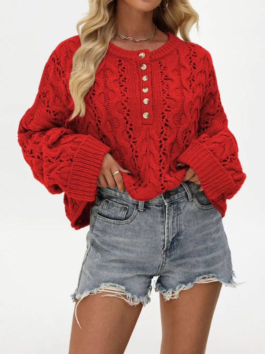 Red pullover sweater featuring cable-knit and cable knit