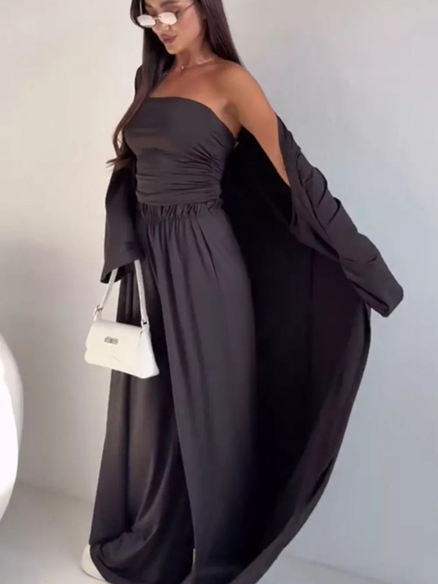 Chic dark gray three-piece maternity set with ruched strapless top, wide-leg pants, and flowing cardigan.