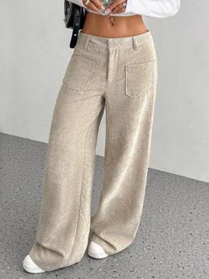 Chic wide-leg corduroy trousers in apricot with front pockets and a relaxed fit.
