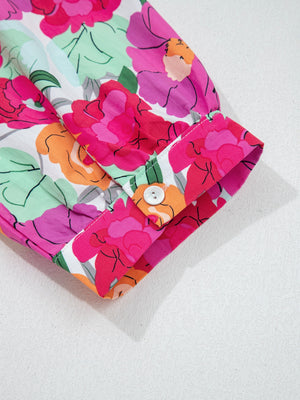 Cotton midi dress with vibrant floral print, V-neck, and button cuff detail.