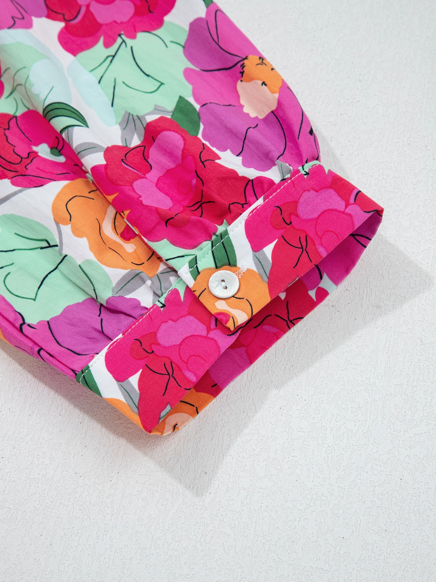 Cotton midi dress with vibrant floral print, V-neck, and button cuff detail.