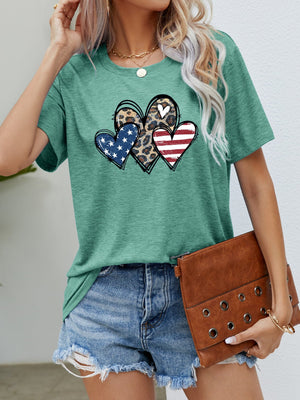 Green crew neck t-shirt with leopard print and American flag hearts graphic.