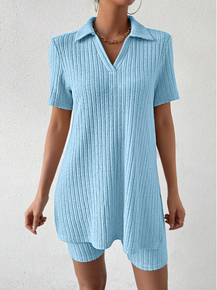 Light blue ribbed polo shirt and shorts co-ord set with a v-neck and collar.