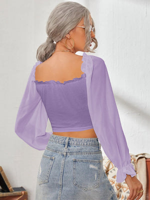 Purple bustier sleeve blouse with square neckline and ruffled cuffs.