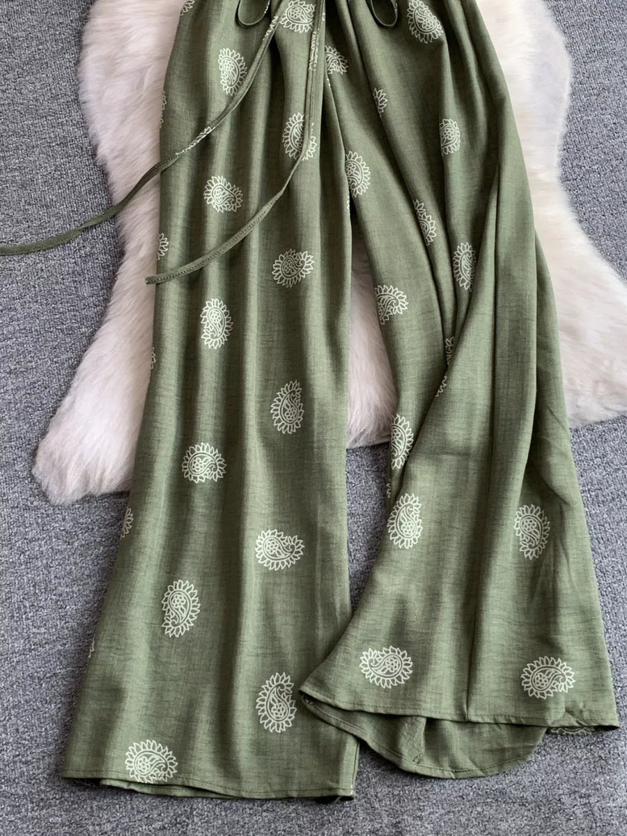 Green paisley print drawstring maternity joggers with wide legs.