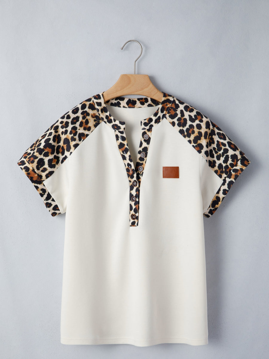 Beige buttoned blouse with leopard print sleeves and collar, short sleeves, henley neckline.