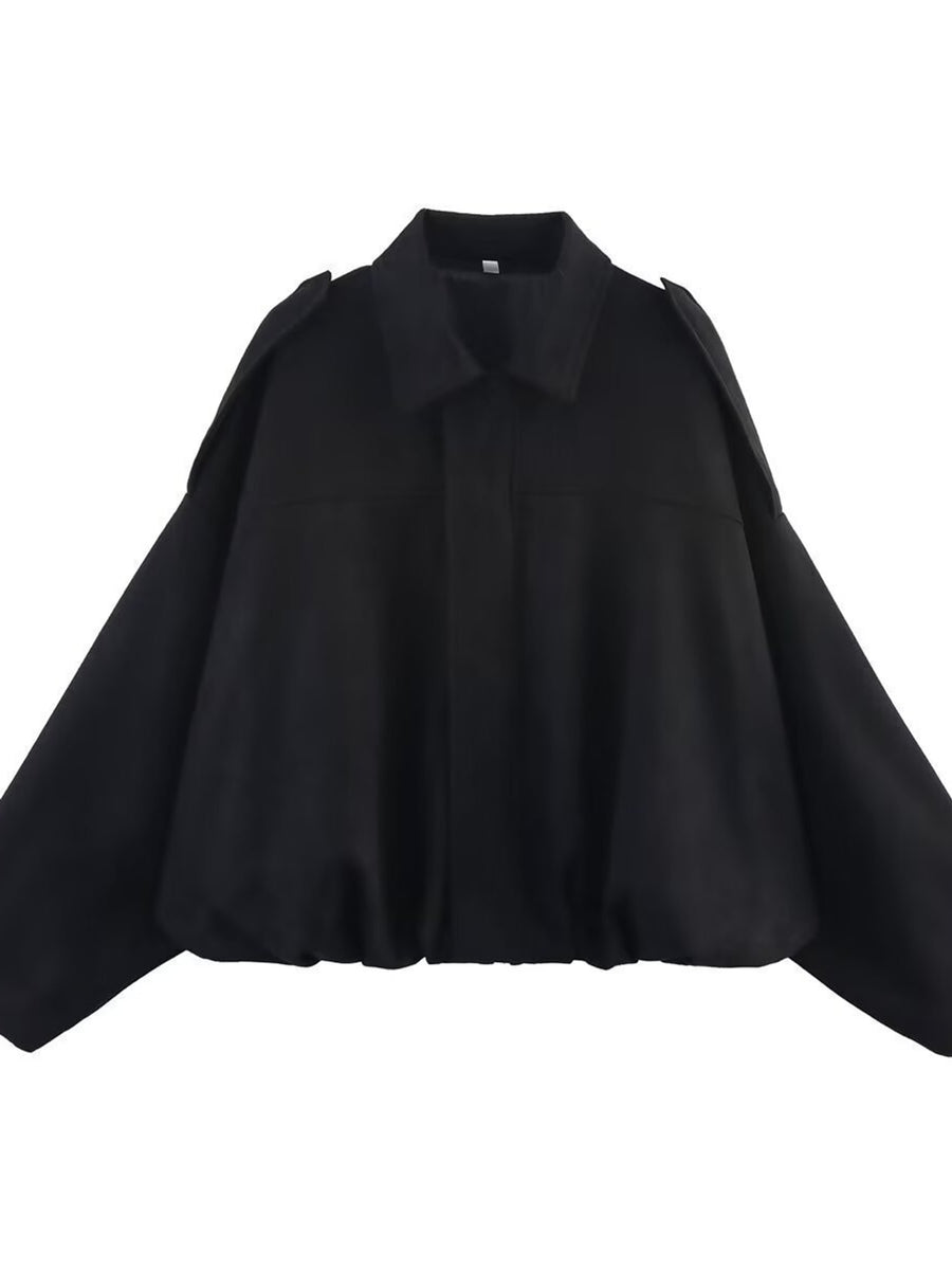 bomber jacket in black featuring zipper and oversized fit