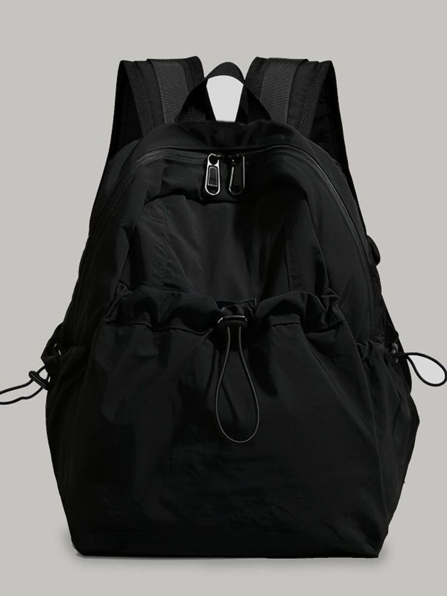 Black lightweight nylon backpack with drawstring closure and adjustable straps.