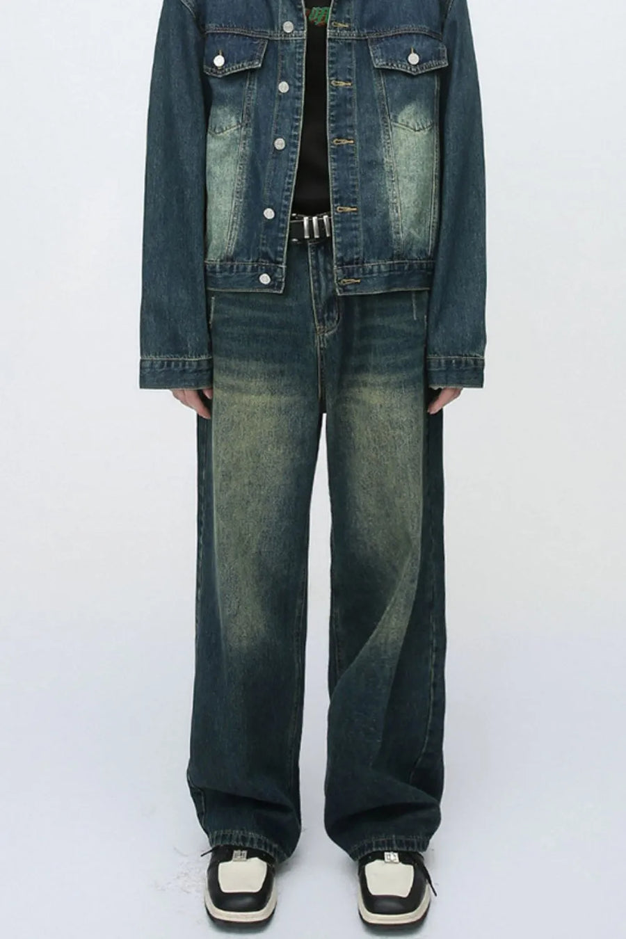 Relaxed fit dark wash denim jeans with a faded, distressed look.