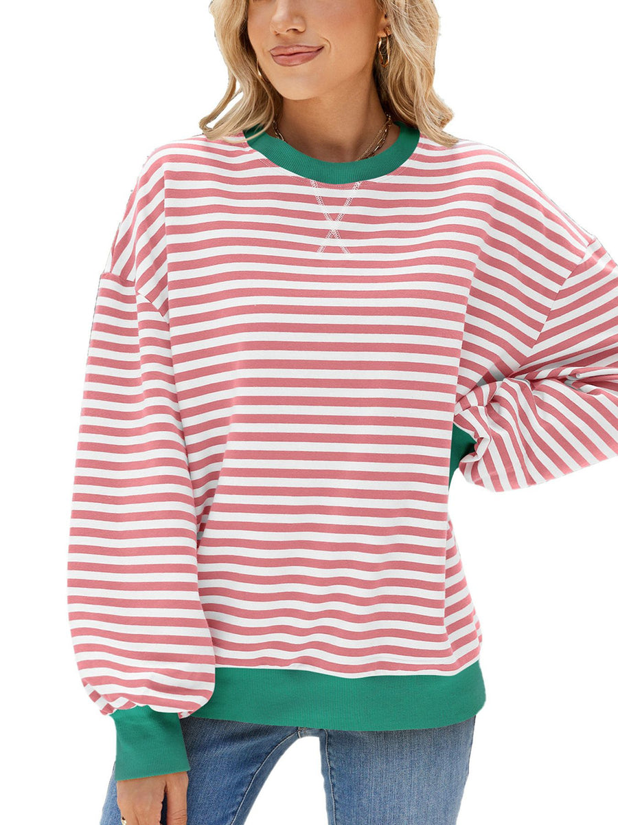 Striped crew neck sweatshirt with green collar and cuffs, in coral and white stripes.
