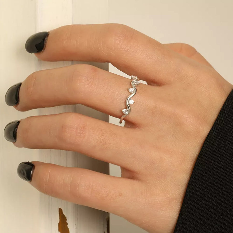 silver ring with wave and none