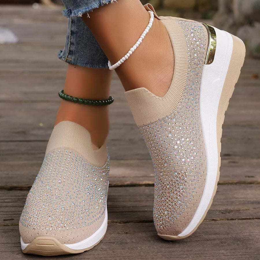 Black sneakers featuring rhinestone embellishment and rhinestone-embellished