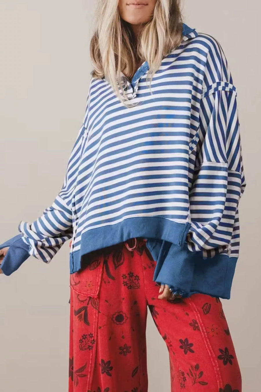 royal blue sweatshirt featuring buttoned placket and striped